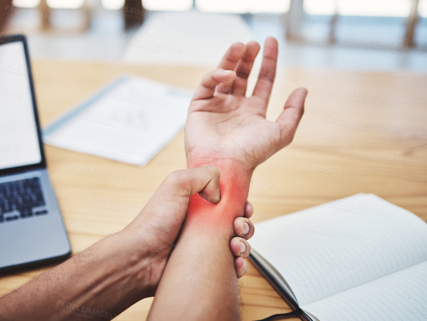 Buy stock photo Businessman, wrist pain and injury at desk working, planning and writing in workplace with laptop. Painful muscle, male hand and overworked from typing with sore arm, notebook at work table.