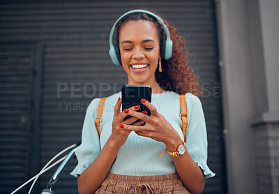 Buy stock photo Phone, music and social media with a black woman streaming audio through a subscription service in the city. Travel, communication and text message with a young female networking in an urban town