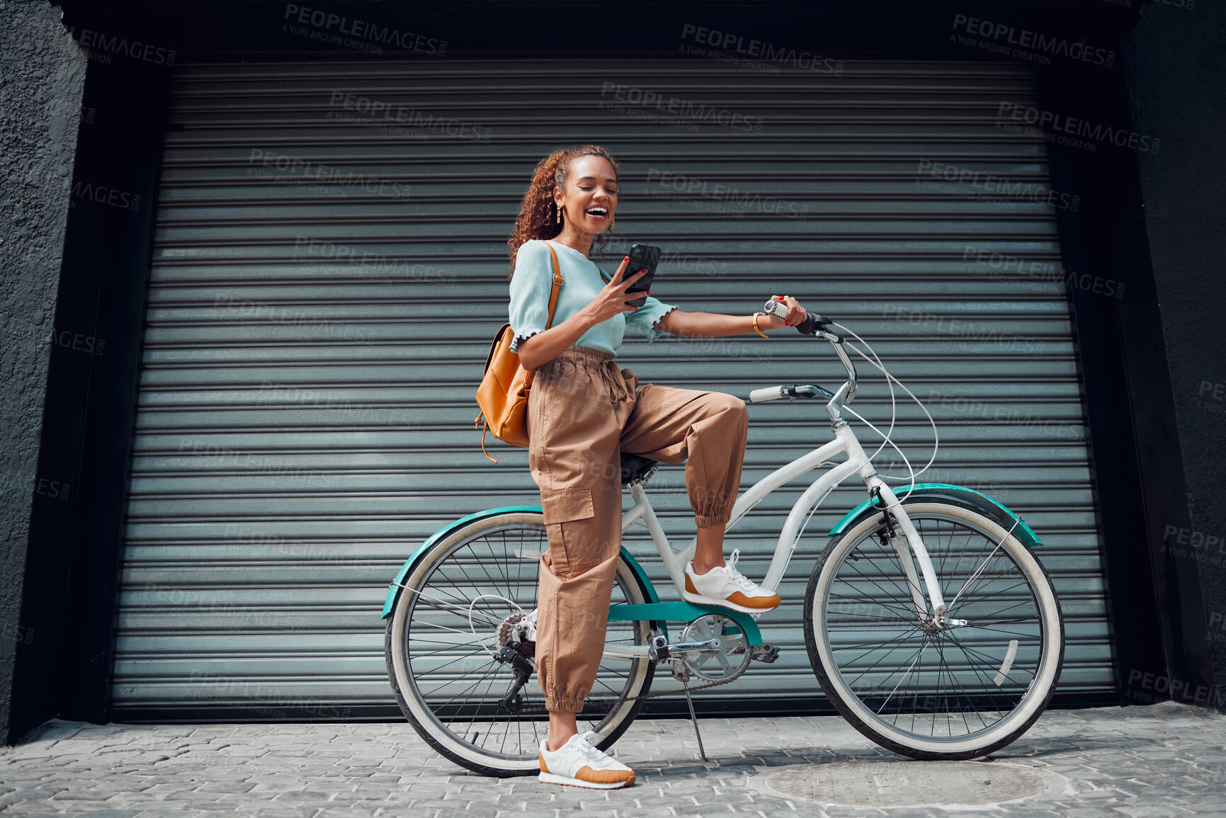 Buy stock photo Bicycle, woman and phone in city feeling excited and happy about message while outdoor in summer with trendy look. Eco friendly transportation for carbon footprint female on a bike using 5g network