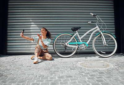 Buy stock photo Bicycle, street and woman taking a selfie in a city blowing a kiss in photo or pictures in summer outdoors. Freedom, bike and young girl creating phone content for social media followers in holidays