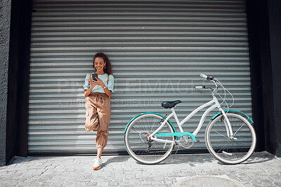 Buy stock photo Phone, bicycle and girl on social media in the city searching for cool, funky and trendy online content outdoors. Smile, bike and happy woman texting on a social network for cycling on the internet