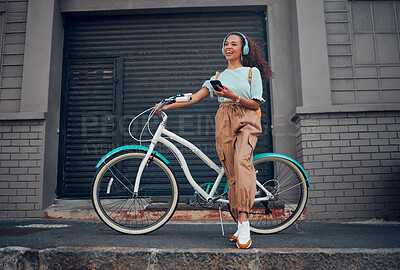 Buy stock photo Bicycle, phone and happy woman with headphones for music while on walk in the city street. Happiness, smile and girl from Puerto Rico listening to audio, podcast or radio on smartphone in urban road.