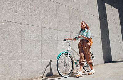 Buy stock photo Bike, urban and city woman on a bicycle ride walking to cut carbon footprint for sustainability. Person relax after riding on a summer day feeling calm and relax with eco friendly transportation 