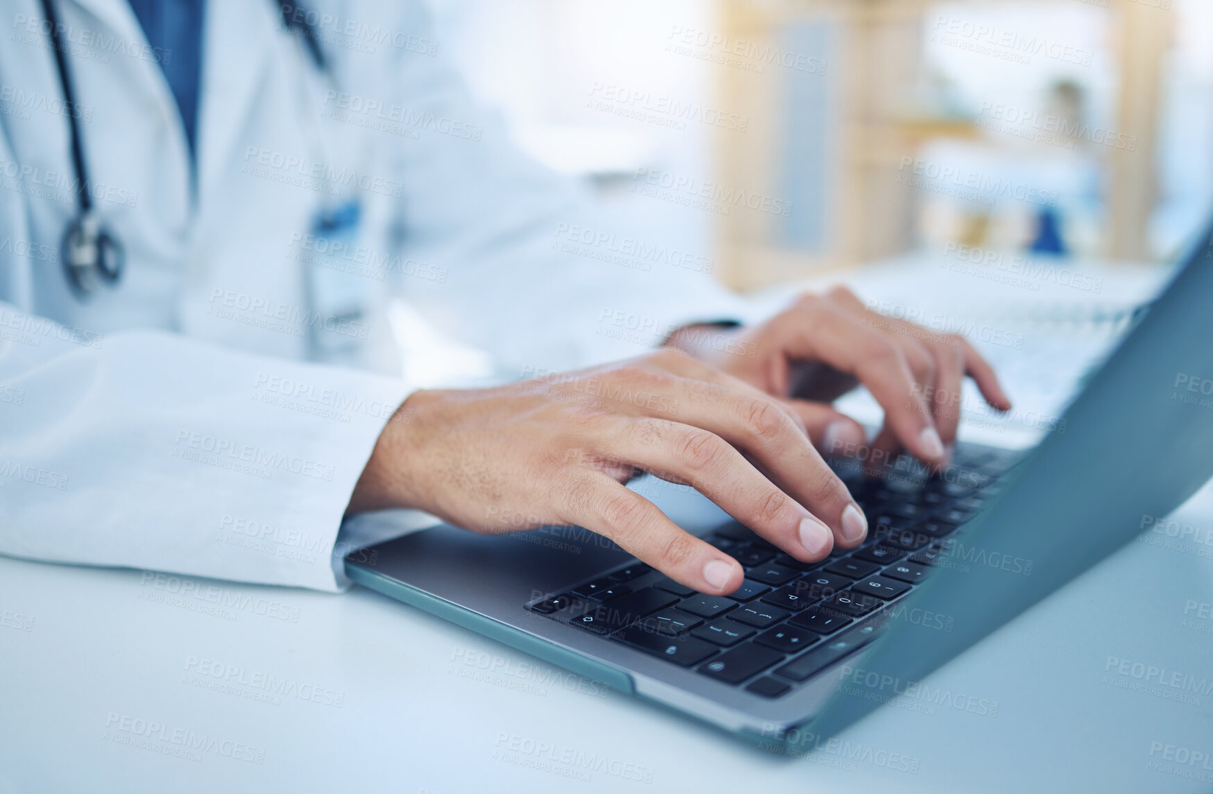 Buy stock photo Hands, laptop and healthcare with a doctor typing for research, doing a search on the internet in a hospital. Computer, medical and analytics with a male medicine professional at work in a clinic