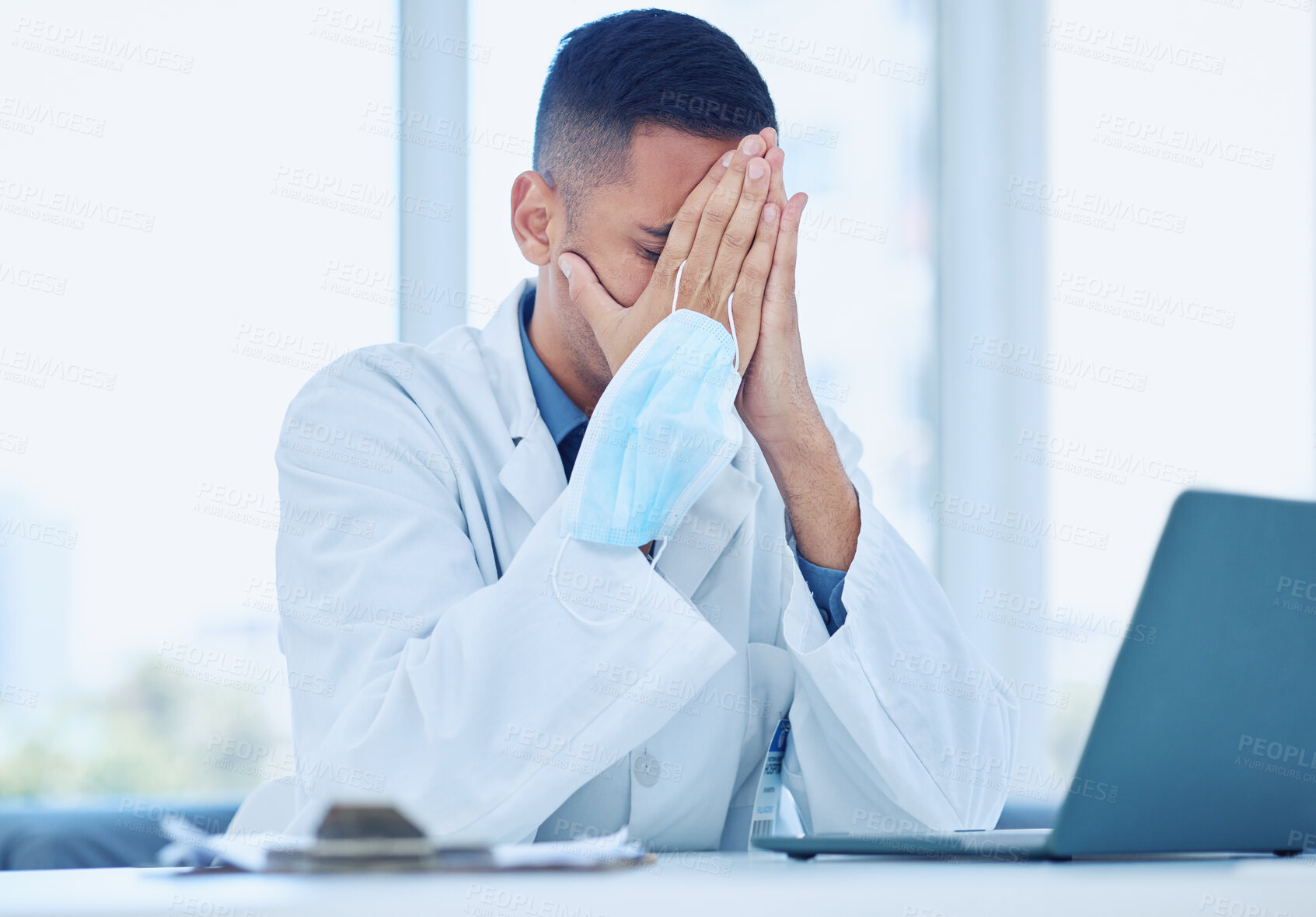 Buy stock photo Covid doctor, tired of mask in office from stress and headache from covid19 patient information report results on laptop. Medical man professional, coronavirus pandemic fear and mental health burnout