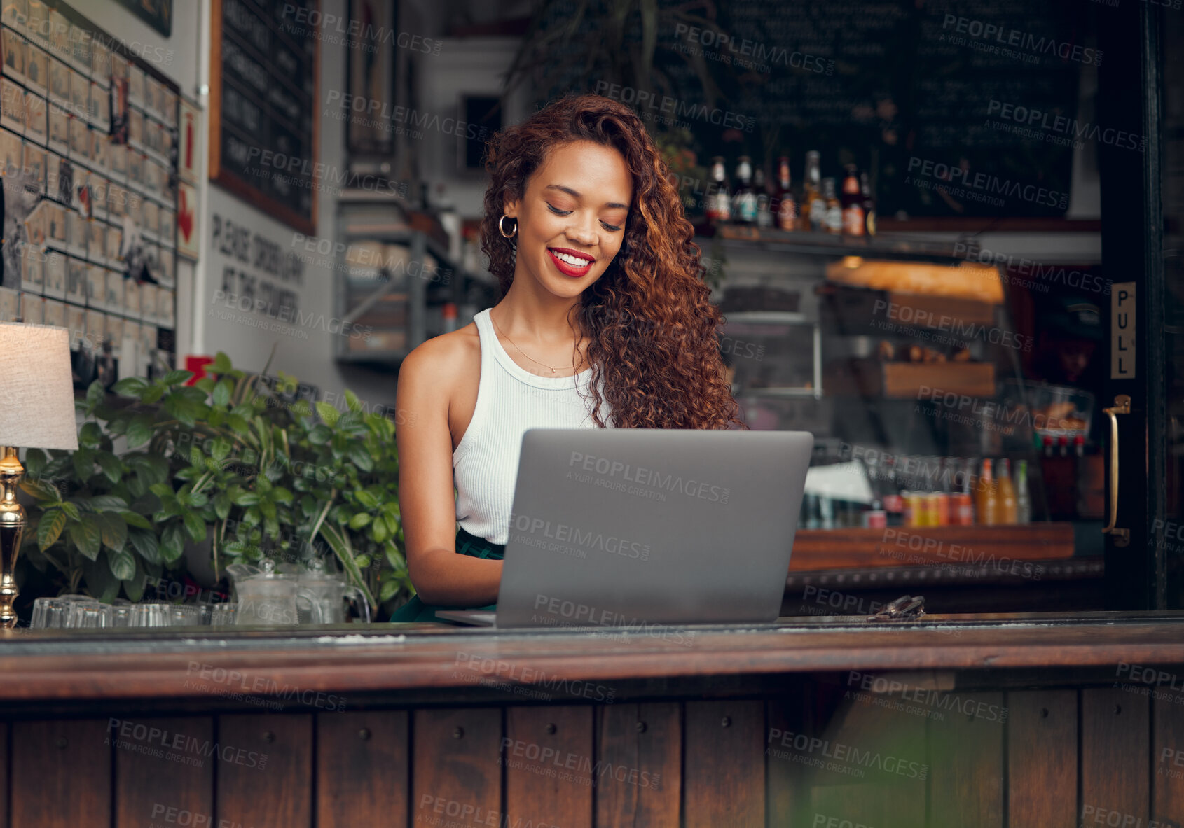 Buy stock photo Remote work, laptop and woman at restaurant typing blog article with satisfied and happy smile. Freelance blogger girl working online and thinking of creative idea at casual cafe in Mexico.