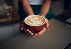 Coffee, art and design with hands of woman in cafe for creative, breakfast and latte. Foam, milk and service with barista and cappuccino at countertop in coffee shop for drink, morning and lifestyle 