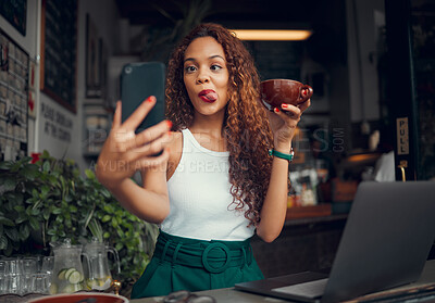 Buy stock photo Selfie, coffee shop and funny with a woman customer using a laptop and phone in her local cafe. Silly, face and mobile with a young female posting a photograph on the internet while in a restaurant