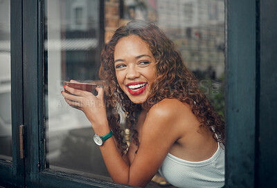 Buy stock photo Coffee shop, window and drink with a black woman in a restaurant to relax alone on the weekend. Cafe, happy and face with a young African American female drinking from a mug or cup with a smile