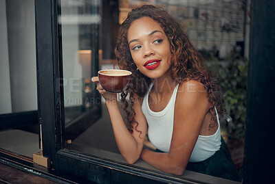 Buy stock photo Coffee, cafe and relax with a black woman drinking from a cup at a window of her local restaurant. Makeup, coffee shop and thinking with an attractive young female enjoying a cappuccino and view