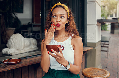 Buy stock photo Coffee, cafe and hand of a black woman with funny face while sitting by a counter at an outdoor restaurant. Coffee shop, quirky and makeup with a playful young female enjoying a drink from a mug