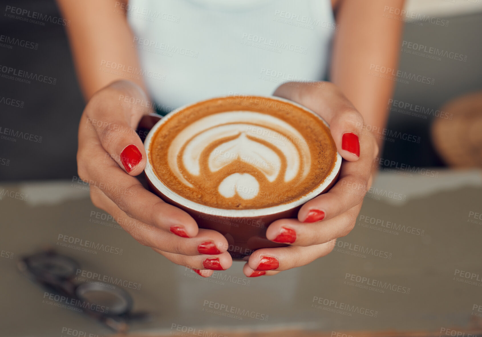 Buy stock photo Cafe, art and coffee woman hands holding caffeine drink cup for leisure break with top view. Barista, espresso and design of cappuccino beverage of girl customer at restaurant table close up.