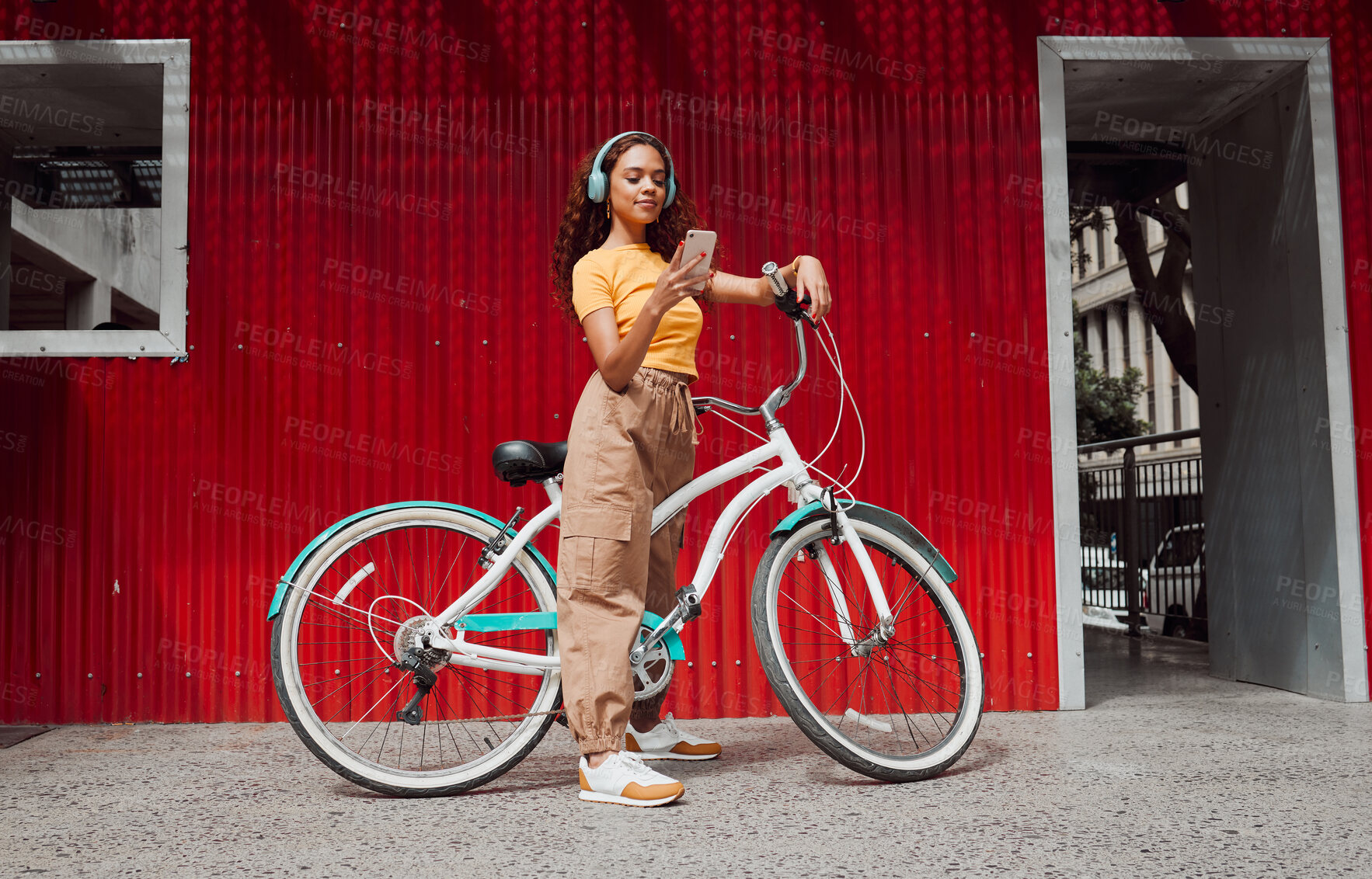 Buy stock photo Woman, bike and phone in city travel with music headphones, 5g podcast or radio. Thinking model, mobile and fashion student on eco friendly, carbon footprint or future Colombian environment transport