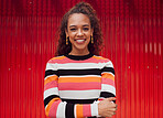 Fashion, smile and woman against a red background in the city during a holiday in Amsterdam. Portrait of a happy, African and young girl on a travel vacation for freedom, adventure and happiness