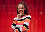 Fashion, happy and black woman against a red wall in the city of Japan for travel holiday. Portrait of a young, urban and African girl with cool clothes on a vacation for freedom and happiness