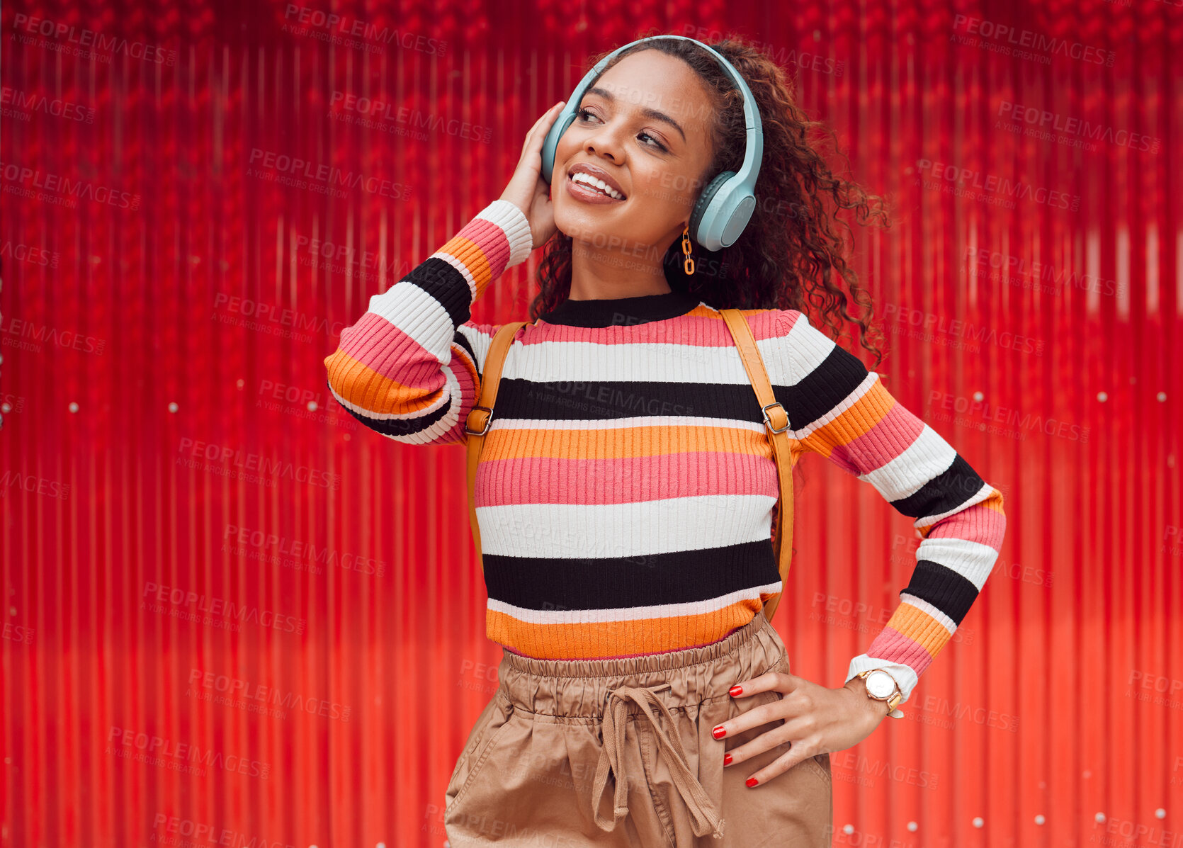 Buy stock photo Music headphone streaming, happy and fashion black woman smile outdoor in Brazil. Happiness of a girl feeling relax freedom and cheerful mindset listening to audio and song track with red background