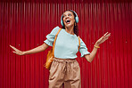 Happy woman streaming music, singing and hip hop dance on stage with headphones. Young musical performer, fun and energy in trendy fashion 




broadway
solo act
dancing
listen to music
hip hop rmb

