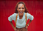 Woman, happy and freedom fashion, smile and outdoor fun on the weekend alone. Portrait of a young female laugh, fashionable and feeling confident while spending her free time with a red background 