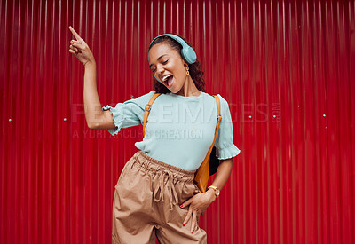 Buy stock photo Music, dance and woman in the city against a red background during a travel holiday in Amsterdam in summer. Happy, smile and girl with freedom, 5g radio and singing with headphones on vacation