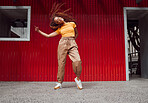 City, hip hop dance and an urban black woman in streetwear dancing outside in Sao Paulo. Music, dancer and a cool happy latino girl with outdoor street style, fun energy, freedom and youth in Brazil.