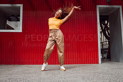Buy stock photo Dance, freedom and fun with a black woman on a red background, dancing or happy with a smile while moving to music. Dancer, free and expression with an attractive young female in rhythmic movement