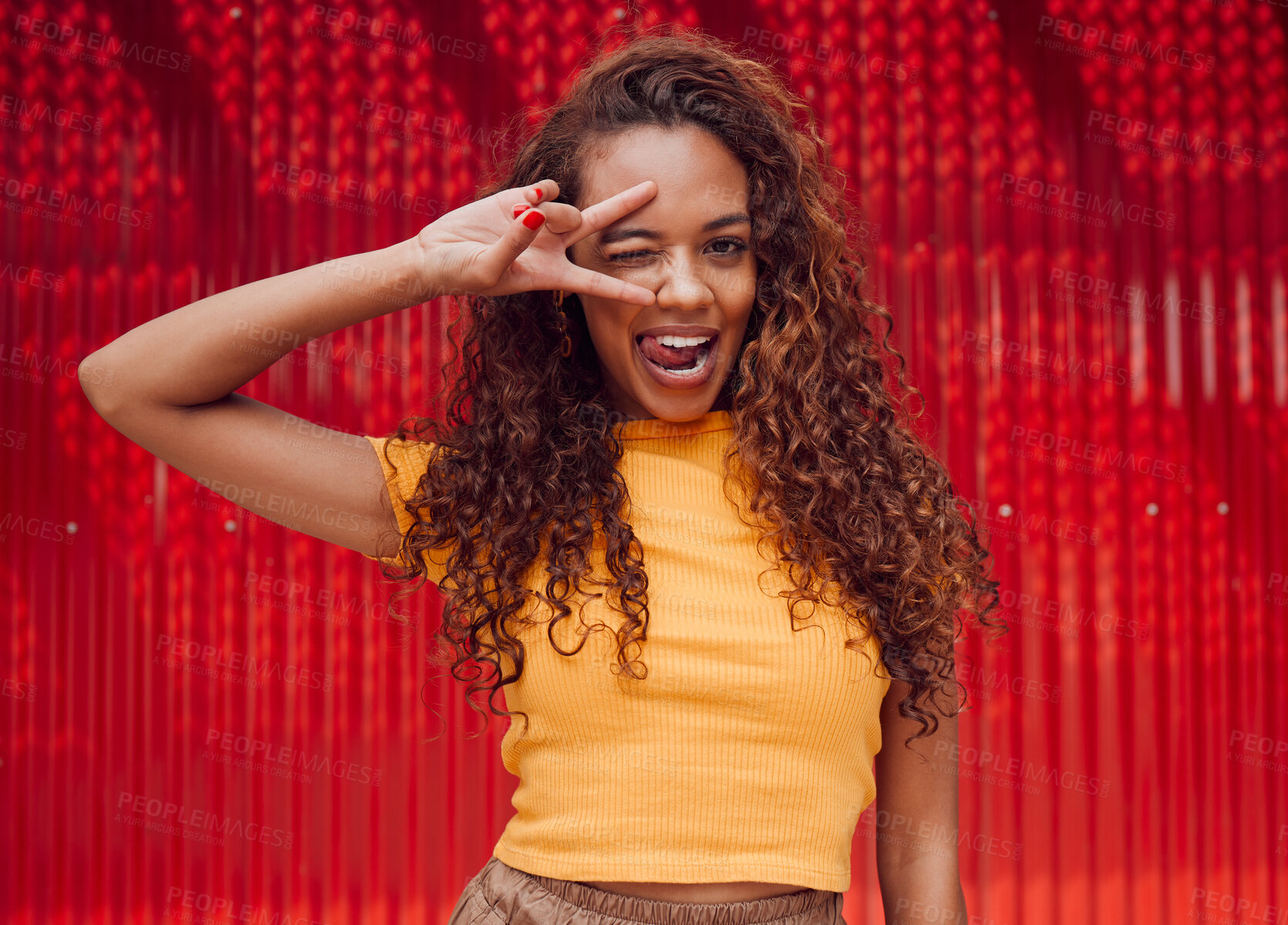 Buy stock photo Crazy face, peace and woman in city on summer adventure, journey or holiday in Puerto Rico. Happy, wink and portrait of silly girl model standing on outdoor street in urban town with red background.