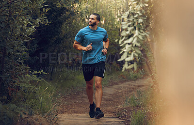 Buy stock photo Running, fitness man and forest run on a trail for exercise, workout and training in nature for health and wellness. Athlete man out jogging or active in the woods with trees and fresh air for cardio