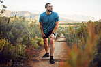 Runner, fitness and tired man on nature park trail for training, exercise and cardio health for a summer marathon. Sport, male athlete and hiking workout while resting and taking break to breathe