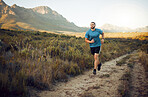 Fitness, mountain and runner running on a trail in nature for exercise, training and cardio workout outdoors. Sports, challenge and active athlete with endurance, discipline and healthy body in Italy