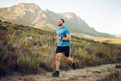 Buy stock photo Running, fitness and mountain nature park road run of a man runner outdoor for exercise. Training, sport and workout of a athlete with fast energy and stamina on a walking and hiking dirt trail