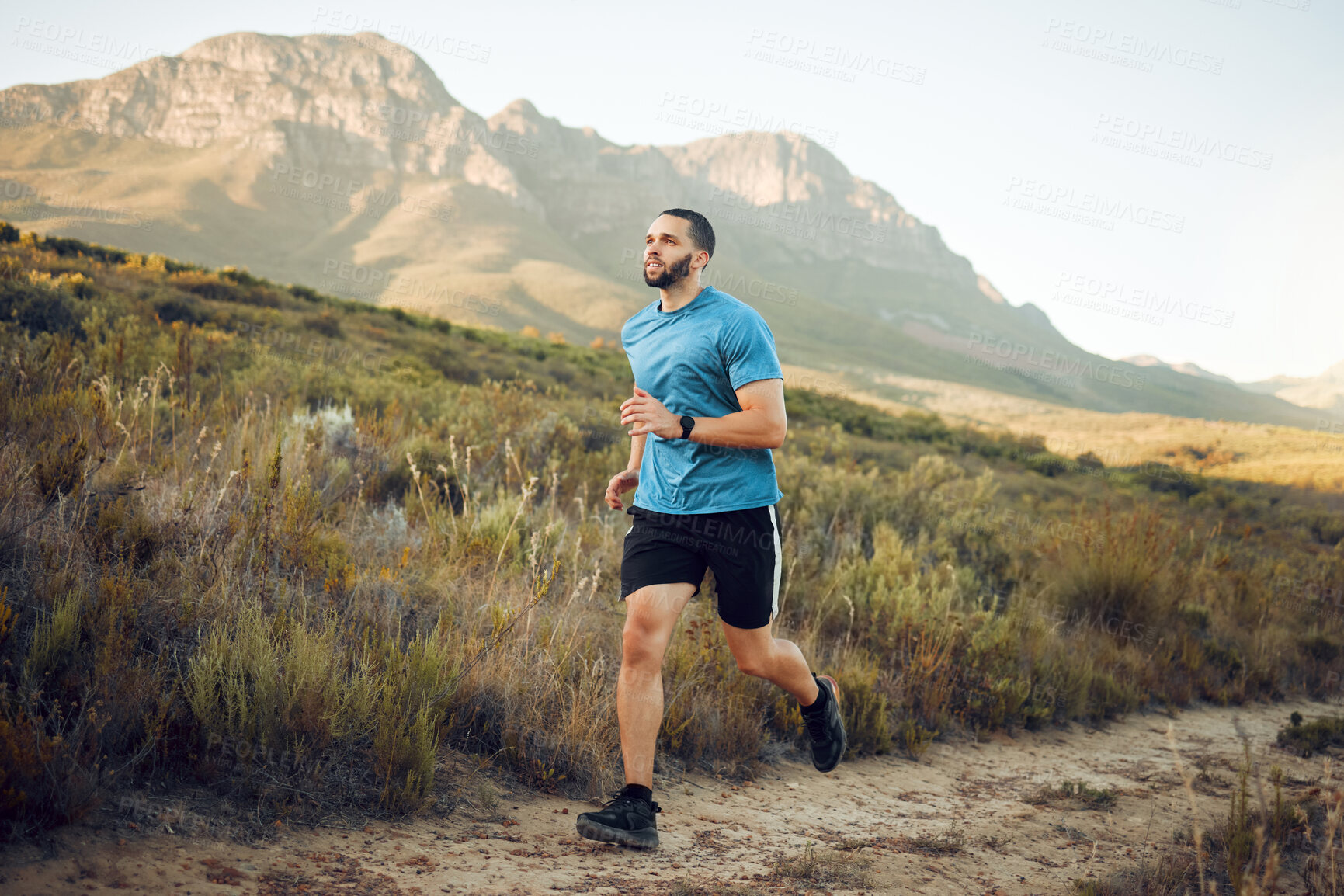 Buy stock photo Running, fitness and mountain nature park road run of a man runner outdoor for exercise. Training, sport and workout of a athlete with fast energy and stamina on a walking and hiking dirt trail