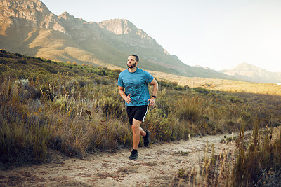 Buy stock photo Health, mountain and man running in nature for fitness, training and sports exercise. Workout, wellness and summer with athlete runner in grass field path for peace, marathon and outdoor morning jog