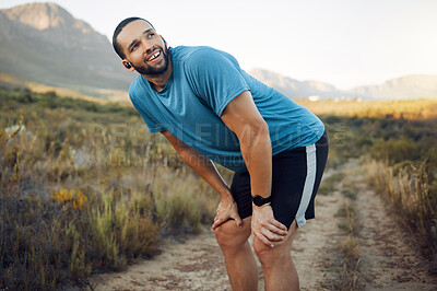 Buy stock photo Running, fitness and man thinking in nature while training in countryside for health. Athlete runner with smile, motivation and idea on a run on a dirt path or field for exercise, workout and cardio