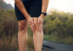 Knee pain, legs and arthritis of runner man, athlete and training, workout or exercise on hiking trail outdoors. Closeup bone fracture problem, muscle injury and body health risk for sports therapy