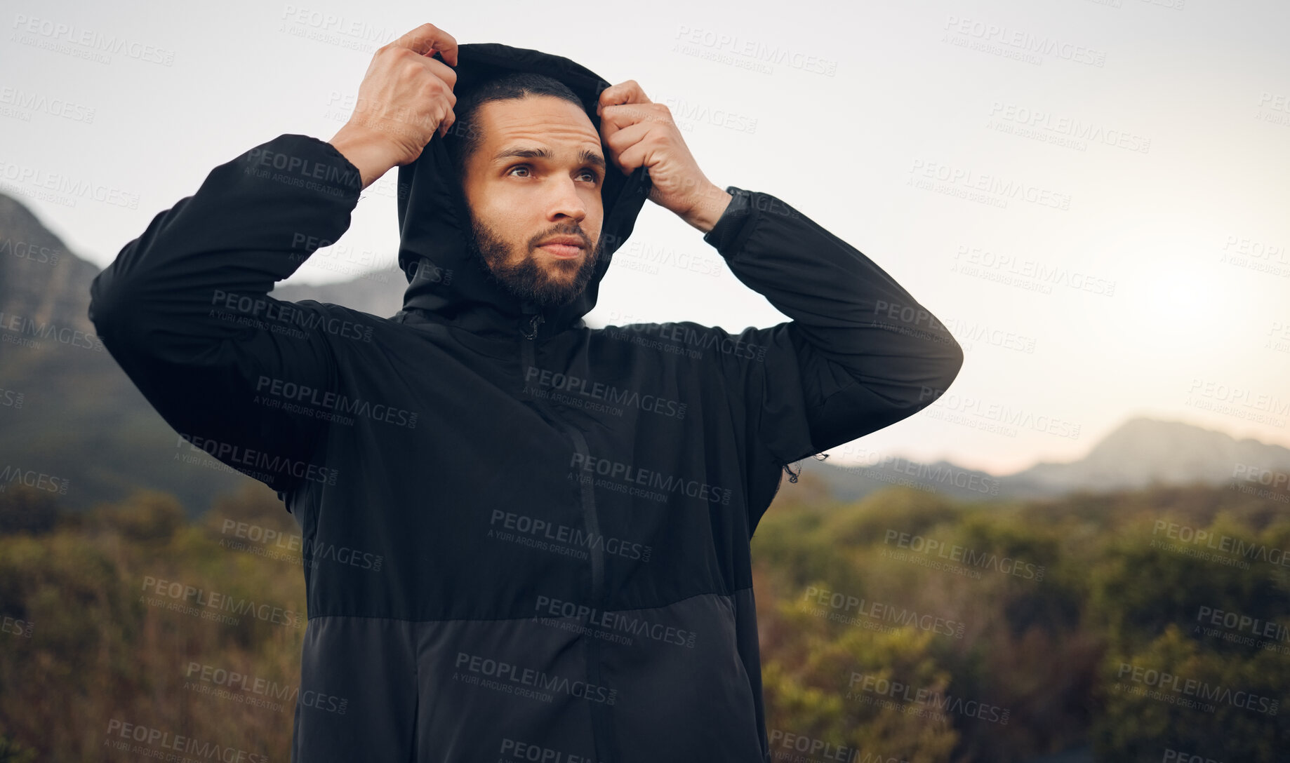 Buy stock photo Hiking man, nature and morning fitness for freedom, running and exercise in mountains, adventure and wellness. Focus mindset of thinking runner with hoodie for cold, calm and healthy training workout