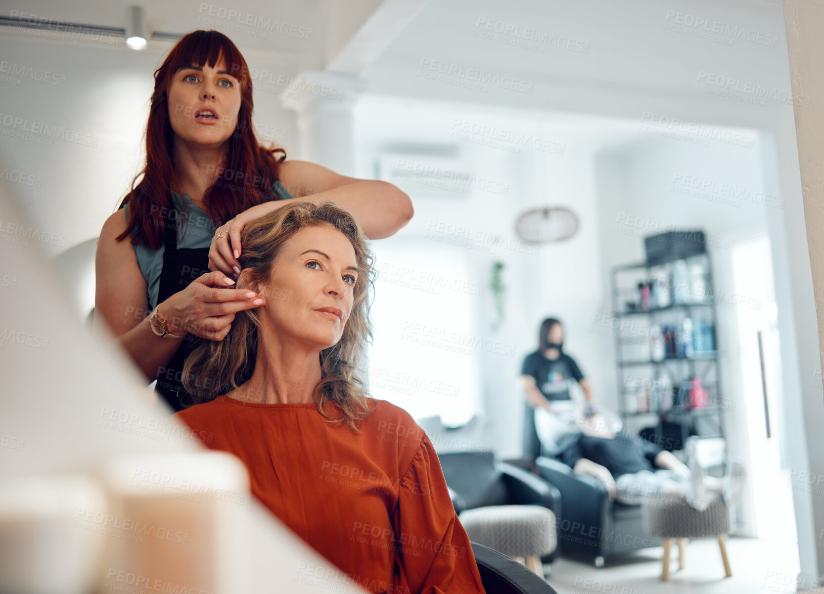 Buy stock photo Mirror reflection of senior woman, hairdresser and salon studio employee working on client haircut, hair care or treatment. Designer hair salon, beauty spa service and stylist work on customer hair