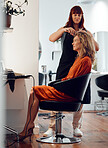 Woman, hair and chair at hairdresser with smile in salon for fashion, beauty or haircut. Senior, hairstyle and beautician working on customer, client or patron hair for makeover, cosmetics or trend