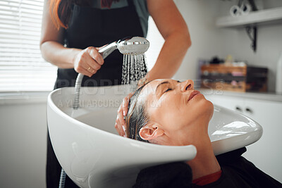 Buy stock photo A woman salon, hairdresser cleaning hair in sink and relax after haircare treatment for selfcare wellness. Professional hair stylist, beautician washing and styling lady hairstyle luxury beauty salon