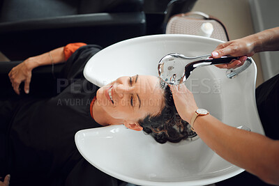 Buy stock photo Happy woman, hairdresser and washing hair at luxury salon with water, tap and basin from above. Female customer or client cleaning head with professional stylist in beauty store with rinse process