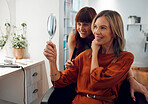 Salon, hairdresser and mirror with a woman customer looking at her reflection with a stylist after haircare or a new hairstyle. 