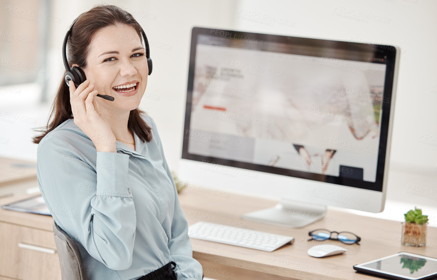 Buy stock photo Call center employee, phone call and woman at desk, communication and working in customer service or telemarketing. Agent with headset, computer and consulting with client, consultant and support.