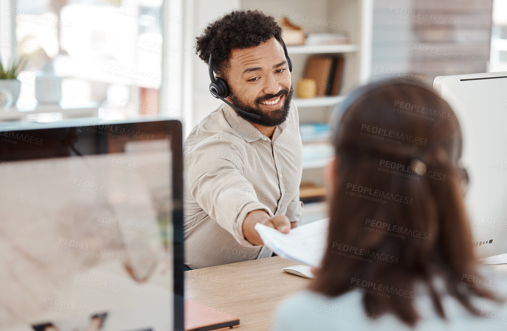 Buy stock photo Paper, call center and smile to woman from man coworker at desk in office. Contact us, crm and customer support worker hands documents to colleague for teamwork, target or learning in consulting job