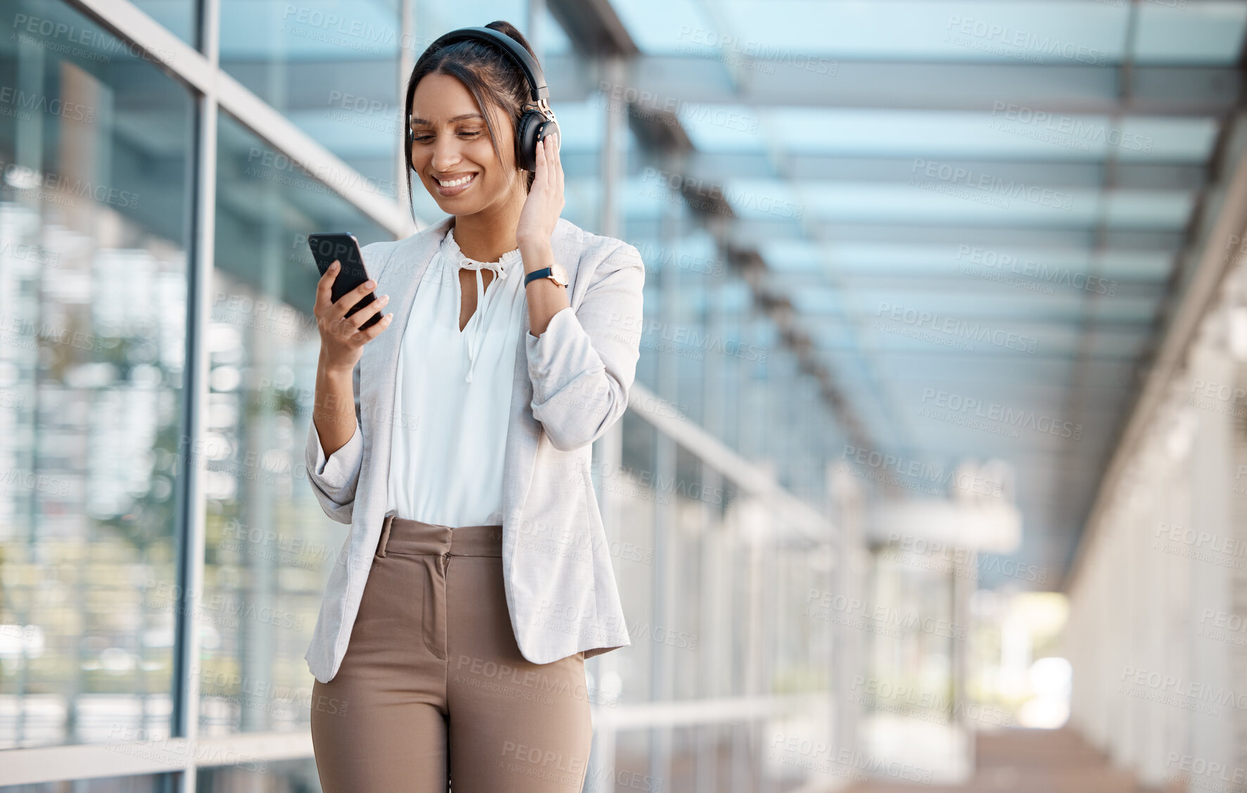 Buy stock photo Phone, business and woman streaming music online in headphones listening to radio, podcast or audio sound. Smile, office and happy employee playing a song on subscription playlist on a break at work