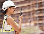 Construction, engineer and woman with walkie talkie, communication and safety check at construction site. Engineering, building and construction worker, protection helmet and inspection of work.