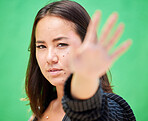 Hand of woman blur, portrait of stop sign gesture and young asian girl warning on green screen background. Female empowerment future of gen z, proud professional opinion and voice problem danger