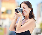 Photographer, city photography and digital camera woman take urban photoshoot for memory on world, global or international travel. Vacation tour, smile and happy asian girl shooting outdoor Singapore