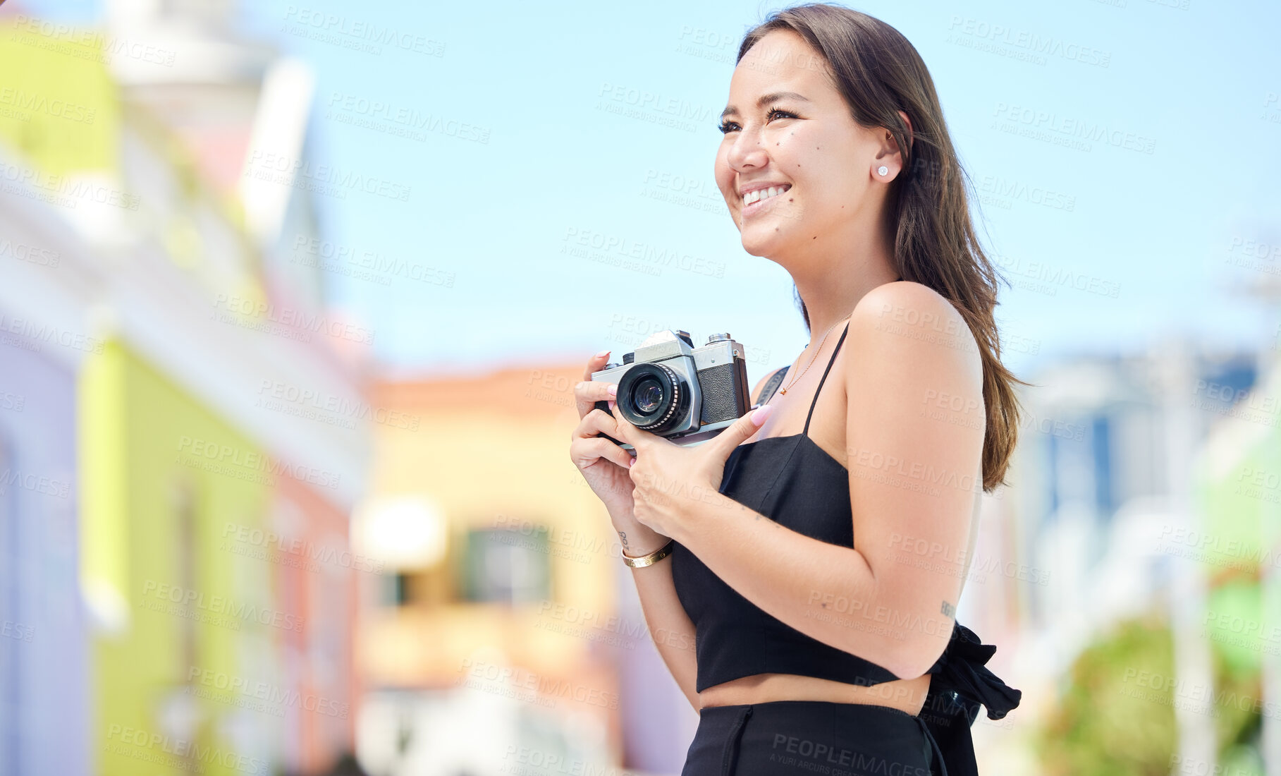 Buy stock photo Photography, summer and happy photographer with camera shooting pictures of colorful houses in the city. Smile, woman and creative freelancer takes a photo of Cape Town on a holiday vacation outdoors