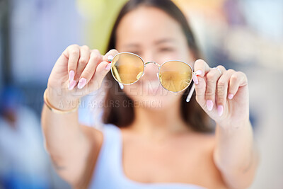 Buy stock photo Summer, fashion and sunglasses in hands of woman for style and beauty. Sunshine, holiday and Asian woman with stylish accessories in the city to enjoy vacation, travel and adventure on a sunny day