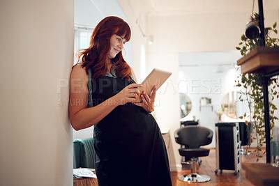 Buy stock photo Salon, tablet and schedule with a woman hairdresser checking her appointment or online booking. Calendar, technology and stylist with a female worker or small business owner in the hair care industry