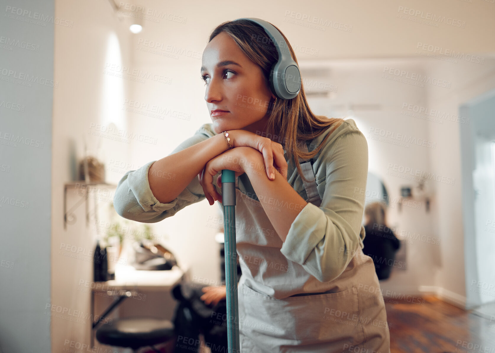 Buy stock photo Woman, cleaning and tired with music in headphones while cleaning room in home. Cleaner, thinking and contemplating while listening to radio, podcast or streaming with rest, exhausted and burnout